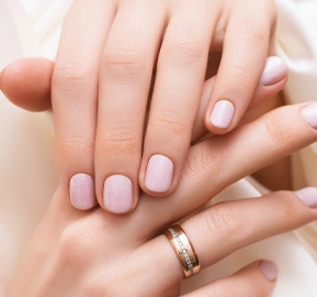 Pink nail design female hands with glitter manicure